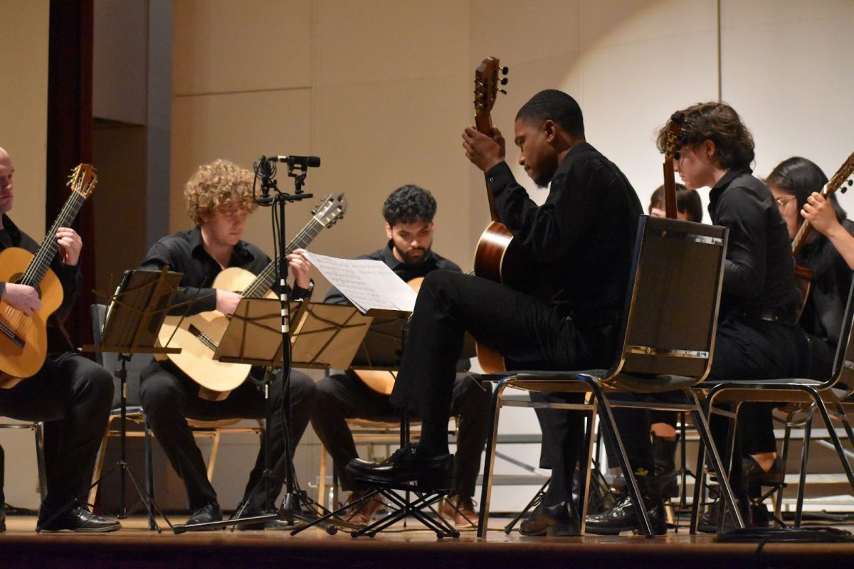 Members of the Guilford Guitar Ensemble perform at the annual spring concert on April 6. Left to right: Noah Dabney, Luke Trainor, Axel Sandoval-Pineda, Lexi McGraw, Yanka Castro, Bec Cormack, Shemar Roberts.
