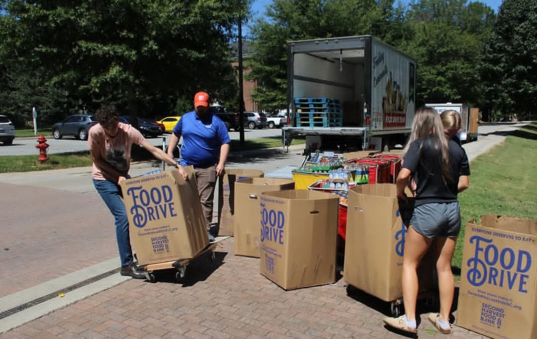 Holiday canned food drive held during men’s basketball home opener
