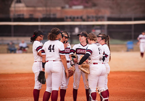 Guilford College softball players gather during a game against Kenyon College on March 1.